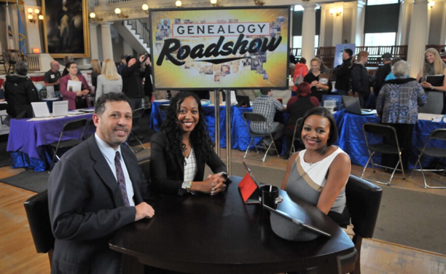 Martine Russell and Father Steven Russell with host Kenyatta Berry.