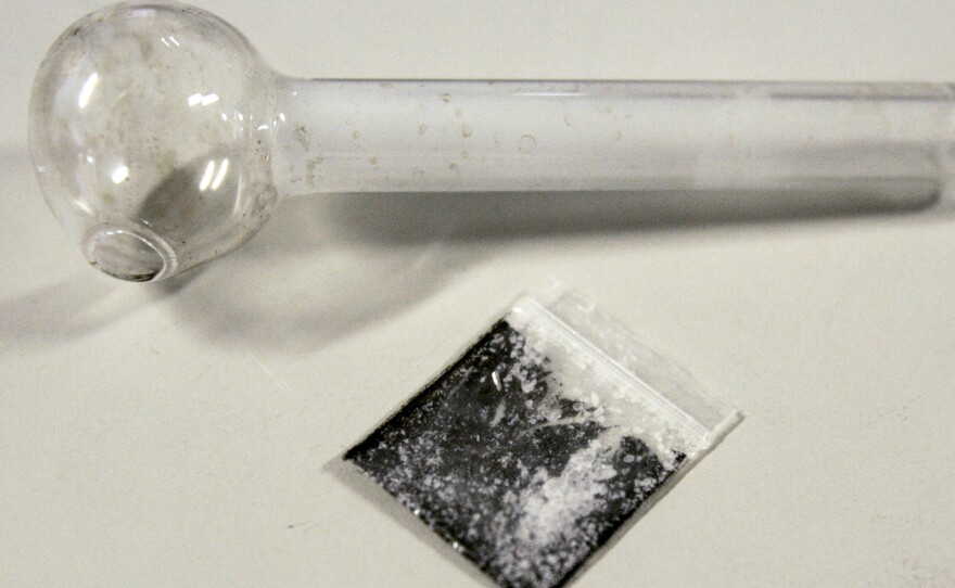 A pouch containing crystalized methamphetamine and a homemade pipe.