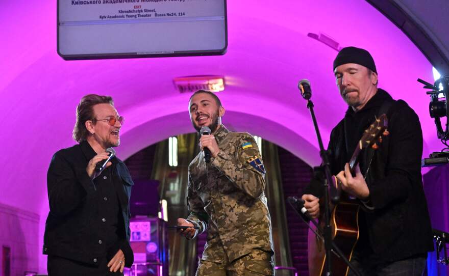 Bono, Taras Topolia and "The Edge" perform at a subway station-turned-bomb shelter in the Ukrainian capital of Kyiv on Sunday.