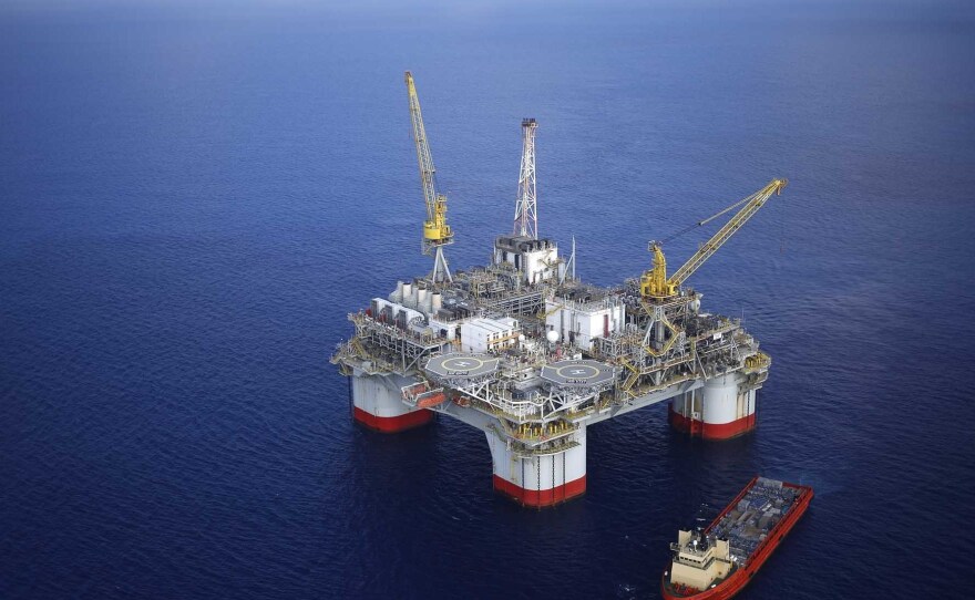 A supply ship sits anchored next to the Chevron Corp. Jack/St. Malo deep water oil platform in the Gulf of Mexico in the aerial photograph taken off the coast of Louisiana, U.S., on Friday, May 18, 2018.