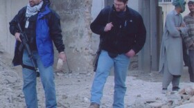 FBI agent Ali H. Soufan, left, interrogated some of the highest ranking Al Qaeda operatives around the world. This picture was taken in Kabul in 2002, outside a presumed hideout for Osama bin Laden.