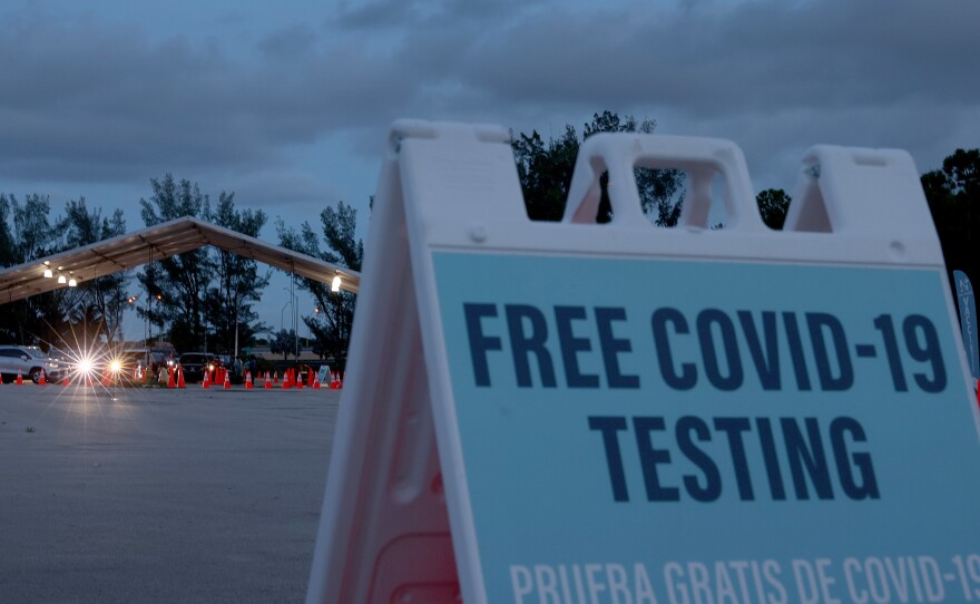 COVID-19 tests are administered at a 24-hour drive-through site set up by Miami-Dade County, Fla., and Nomi Health in August. Some workers will have the option of getting weekly COVID-19 tests instead of being vaccinated.