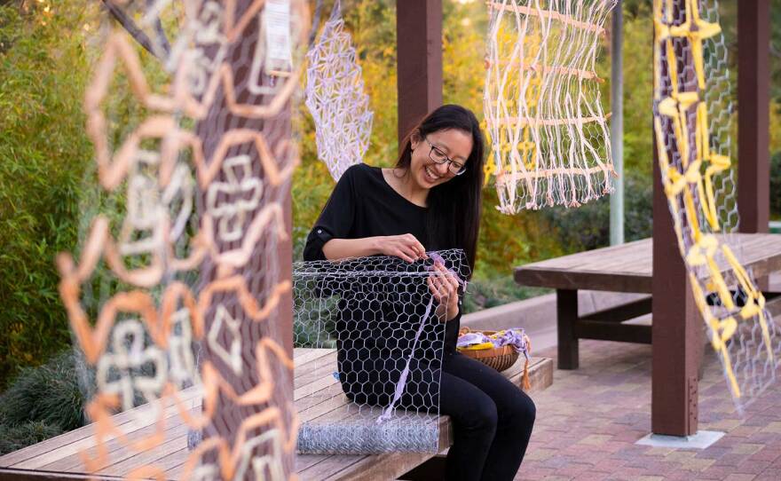 Artist Kristi Lin installs her exhibition, "Borrowed Scenery," at the Japanese Friendship Garden on Feb. 10, 2021. The work is part of the AjA Project's Civil Liberties Project fellowship.