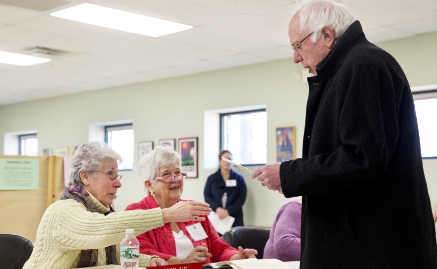 Sen. Bernie Sanders picks up his ballot in Vermont.