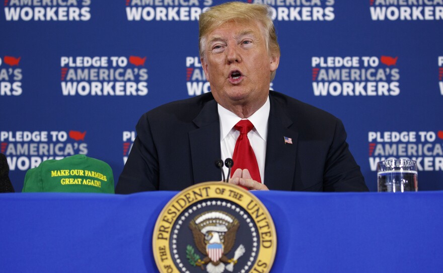 President Trump speaks in Iowa, which has been hit hard by tariffs from other countries issued in retaliation to Trump's tariffs. Trump brought with him new "Make Our Farmers Great Again!" hats.