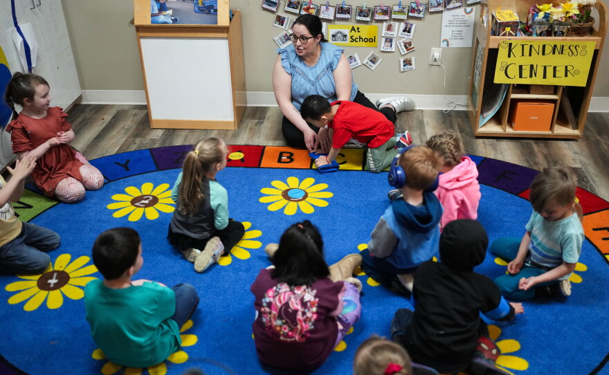 Family educator Lisa Benson-Nuyen addresses her students in a circle in the Northern Lights classroom at the Meadow Lakes CCS Early Learning, a Head Start center, in Wasilla, Alaska, in 2024. The center has since closed because of a lack of staff and money.