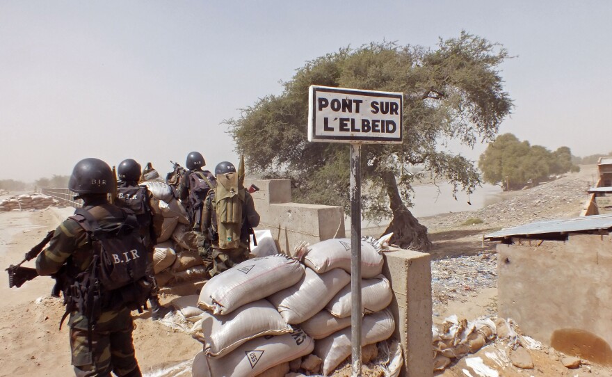 Cameroonian soldiers stand guard at a lookout post on Feb. 25 as they take part in operations against the Islamist extremist group Boko Haram in northern Cameroon, near the border with Nigeria.