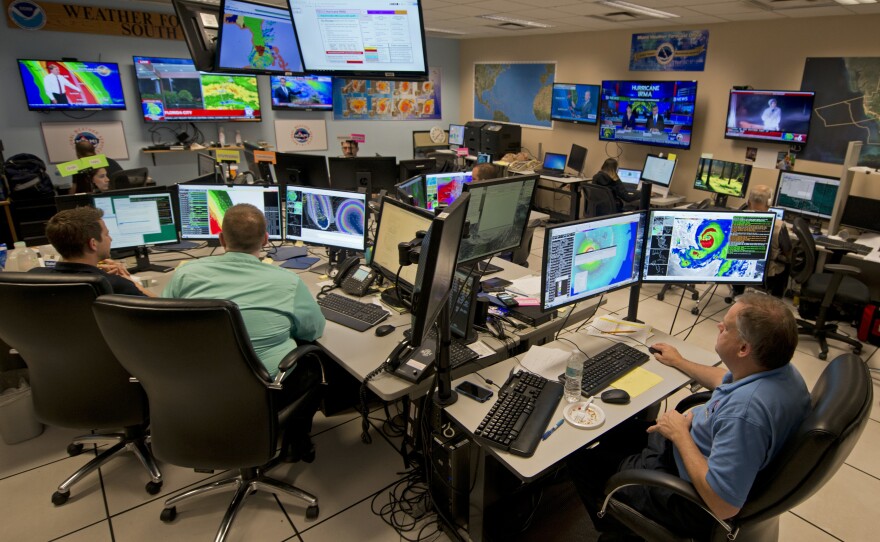 Forecasters at the National Weather Service office monitor Hurricane Irma on Sept. 9, 2017, at the hurricane center in Miami.
