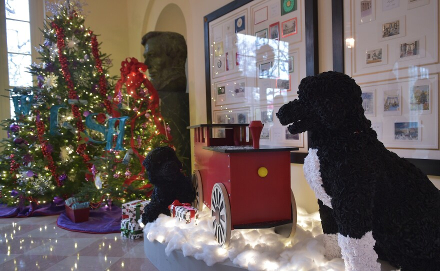 A mechanical Bo (right) and Sonny, life-size versions of the Obama family dogs made of satin ribbon, are stationed in the Bookseller's Room.