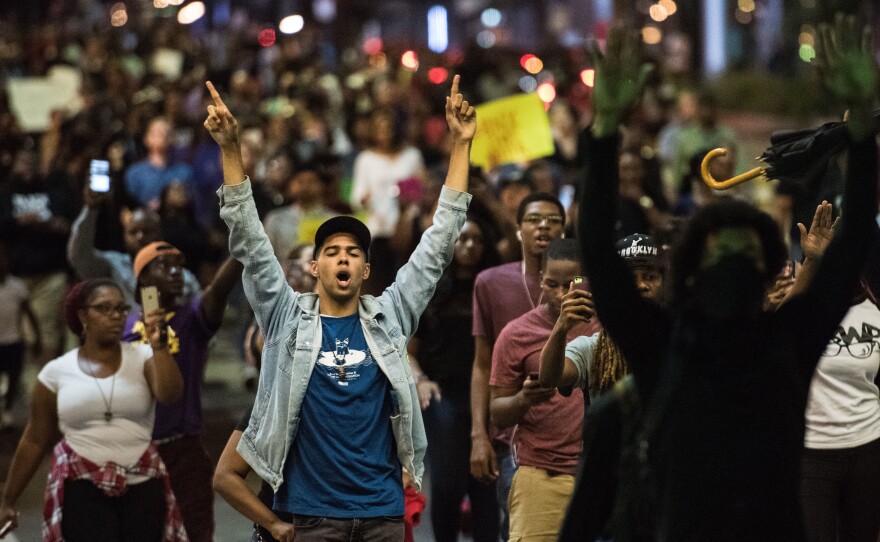Demonstrators fill a downtown city street during protests on Wednesday night in Charlotte, NC. The protests began the previous night following the fatal shooting of 43-year-old Keith Lamont Scott at an apartment complex near UNC Charlotte.