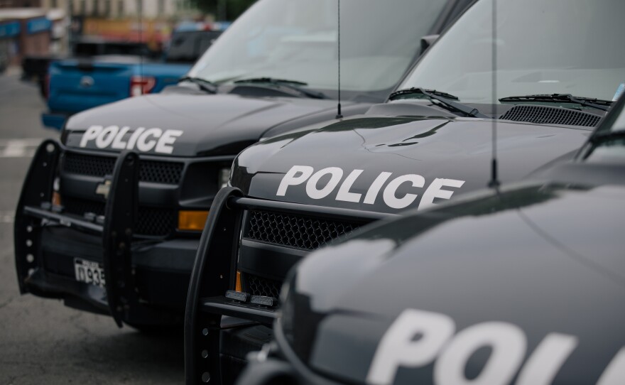 Police vehicles are parked outside the headquarters of the Yonkers Police Department in Yonkers, N.Y. Since 2007, the U.S. Department of Justice has been investigating the Yonkers Police Department and recommending areas for reform.