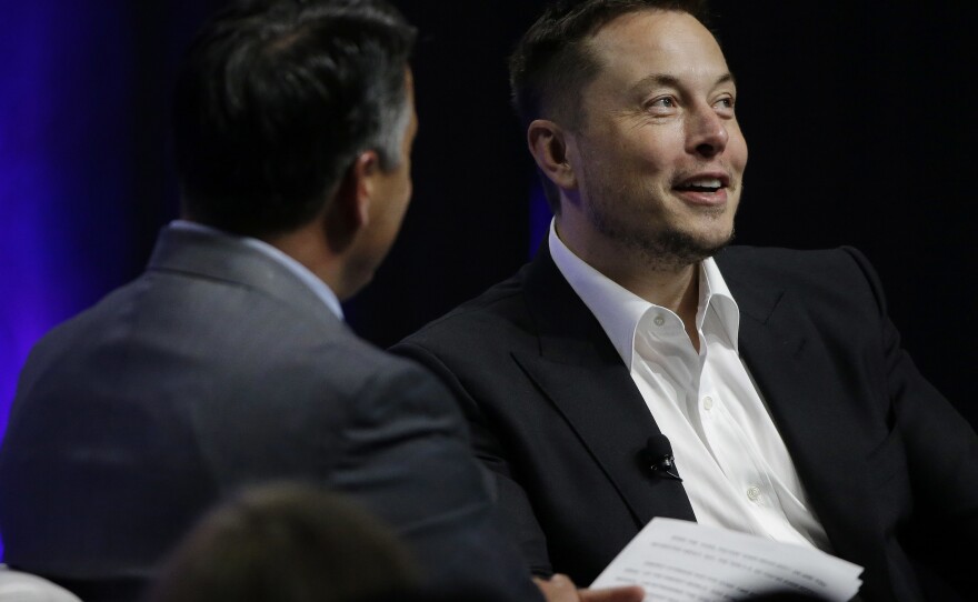 Artificial intelligence poses an existential risk to human civilization, Elon Musk (right) told the National Governors Association meeting Saturday in Providence, R.I.