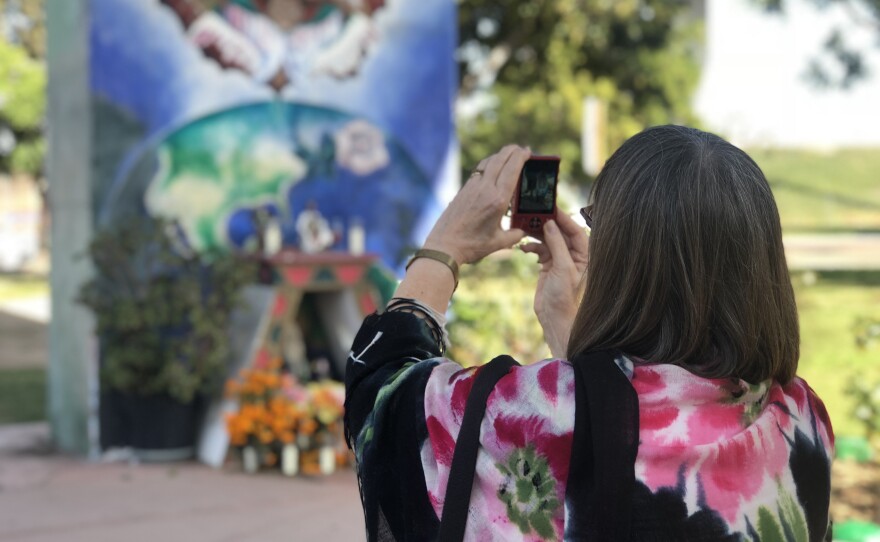 Cherrie Anderson takes a photo in Balboa Park, Nov. 8, 2018.
