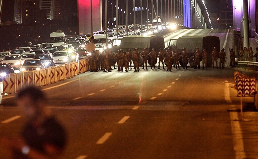 Turkish soldiers block Istanbul's Bosporus bridge on Friday while soldiers also occupied streets in the capital of Ankara.