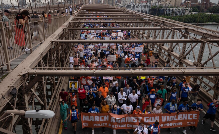 Demonstrators march across the Brooklyn Bridge during the "March for Our Lives" rally in Brooklyn, New York on Saturday.