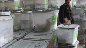 An Afghan security officer guards ballot boxes at the Independent Election Commission in Kabul, Afghanistan, Aug. 29, 2009. Now, the country's Electoral Complaints Commission is investigating hundreds formal complaints of fraud.