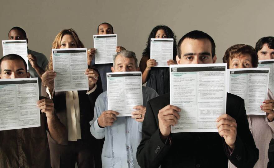 People conceal parts of their faces with forms for the 2010 count in Puerto Rico in a U.S. Census Bureau poster about how it keeps information confidential. Records for the once-a-decade tally cannot be released until 72 years after a count's Census Day.