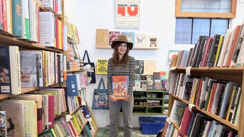 Artist Britton Neubacher was part of the team to archive and compile a new collection of visual art by her partner, late rocker Rick Fröberg. Neubacher holds the book at The Book Catapult in South Park on Jan. 12, 2026.