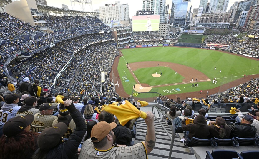 Fans cheer during the Opening Day game of the 2023 Major League Baseball season between the Colorado Rockies and the San Diego Padres at Petco Park in San Diego, California.