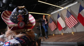 The hat of Diane Benjamin, Dallas #2021 precinct chair, is visible at a campaign event for Texas Attorney General Ken Paxton on May 18, 2026, in Dallas.