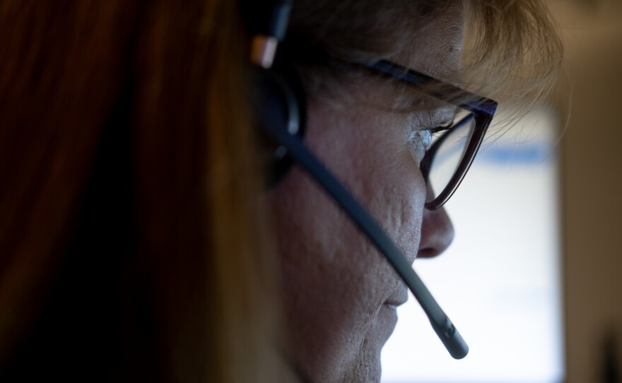 Linda Anderson, an emergency communications technician, during a call at the Denver 911 dispatch center.