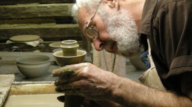 Vernon Owens, a sixth-generation master potter, has been making pots at Jugtown Pottery, Seagrove, North Carolina, for more than 50 years. Pictured: Owens throwing one of the traditional candlesticks for which Jugtown Pottery is famous.