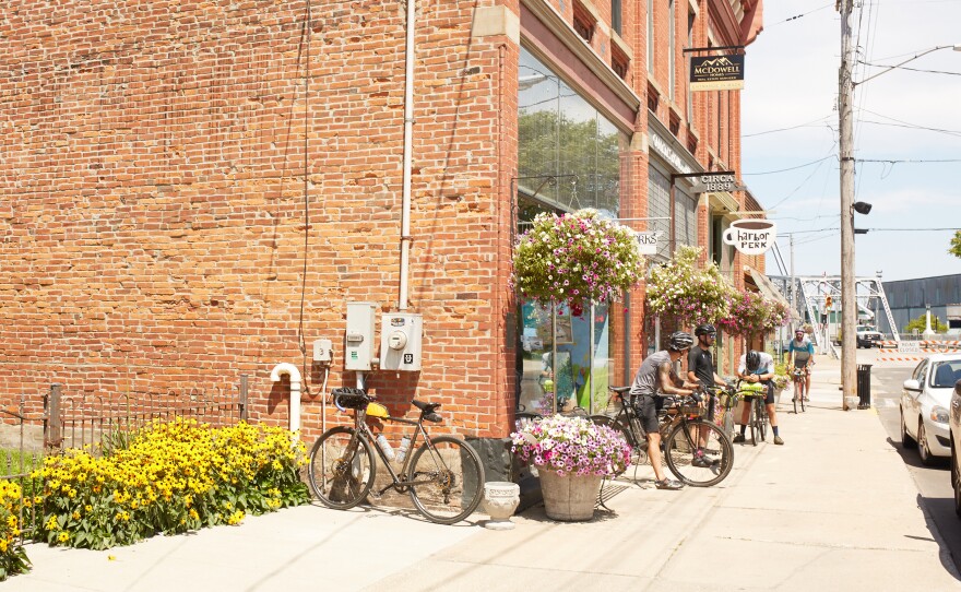 Cyclists camp outside a local cafe on Bridge Street in Ashtabula, Ohio.