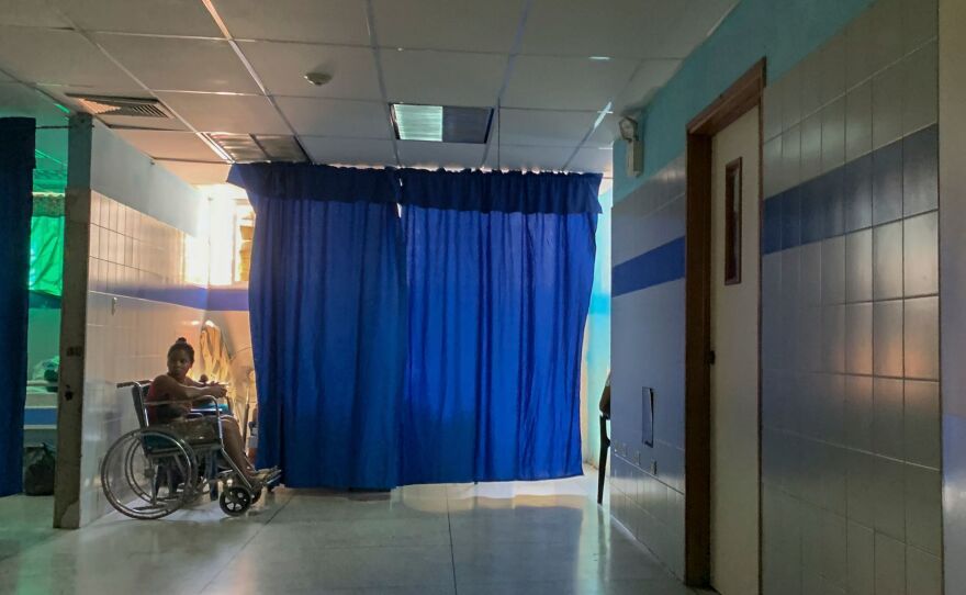 A patient on a wheelchair waits in the emergency room at a hospital in Güiria, Venezuela, on March 14. Human rights organizations recently warned that Venezuela faces catastrophic consequences from the new coronavirus pandemic, which threatens to overwhelm its crumbling health system.