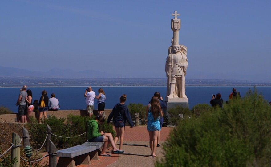 People are shown visiting the Cabrillo National Monument where Juan Rodriguez Cabrillo's statue gazes out over the Pacific, April 10, 2015.