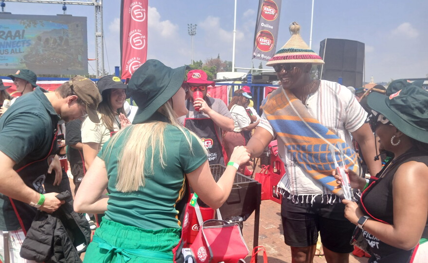 Participants greet each other before starting the braaiing challenge.