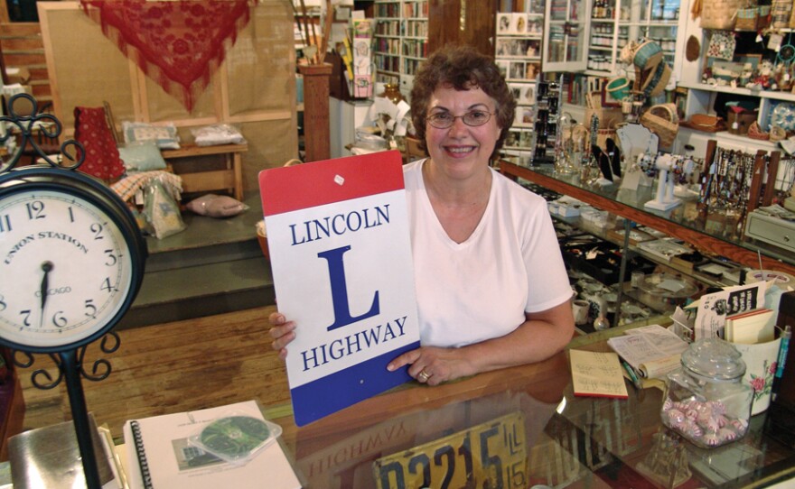 In Franklin Grove, Illinois, you can find all sorts of merchandise that celebrates the history and the enduring charms of the old Lincoln Highway, and Lynn Asp (pictured) has been running a small shop here since 1996. She stocks a good supply of guide books, maps, magnets, coffee cups and T-shirts, too.