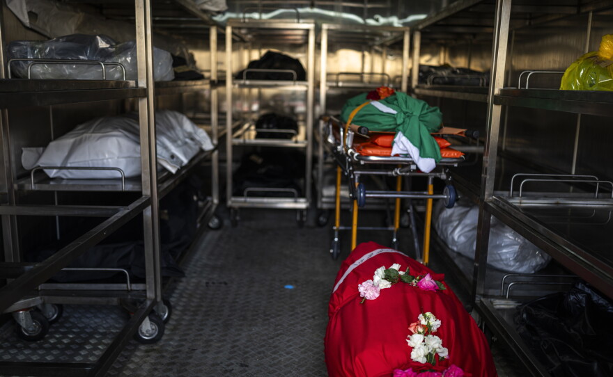 The bodies of Lebanese Civil Defense members Hussein Jaber and Ahmad Noura, who were killed in an Israeli strike on Nabatieh on May 12, lay in the morgue the next day.
