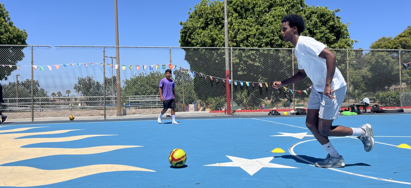Khalid Hassan dribbles a soccer ball at Colina Del Sol Park's basketball courts, July 10, 2025.