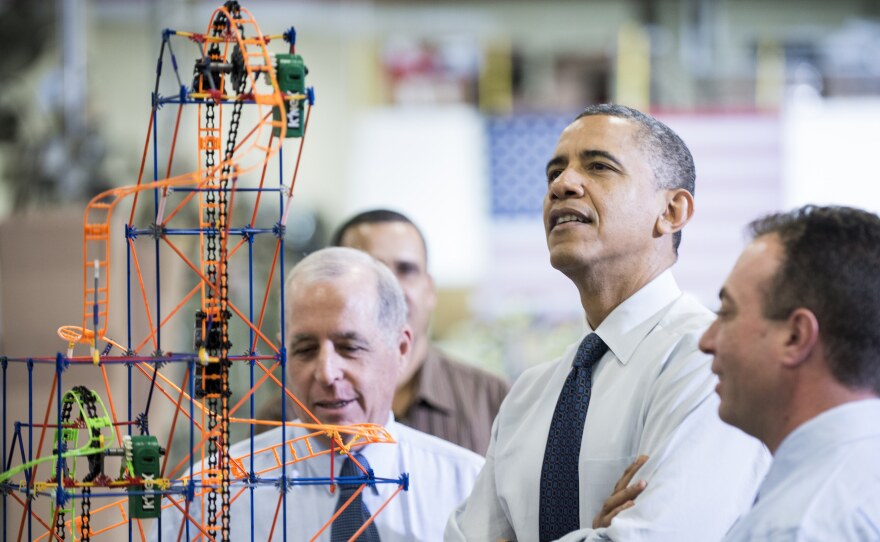 President Obama examines a K'NEX roller coaster on Nov. 30 at a Hatfield, Pa., factory that makes the toys. During the visit, Obama spoke about the economy, the middle class, and his plan to raise taxes on top wage earners.