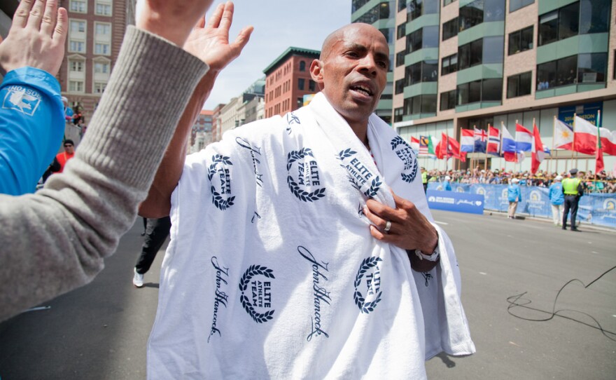 San Diego runner Meb Keflezighi celebrates after winning the Boston Marathon on April 21, 2014.