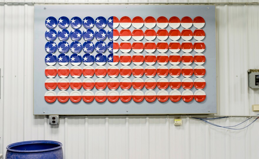 An American flag made of plates is displayed on a wall at the Homer Laughlin China Co.