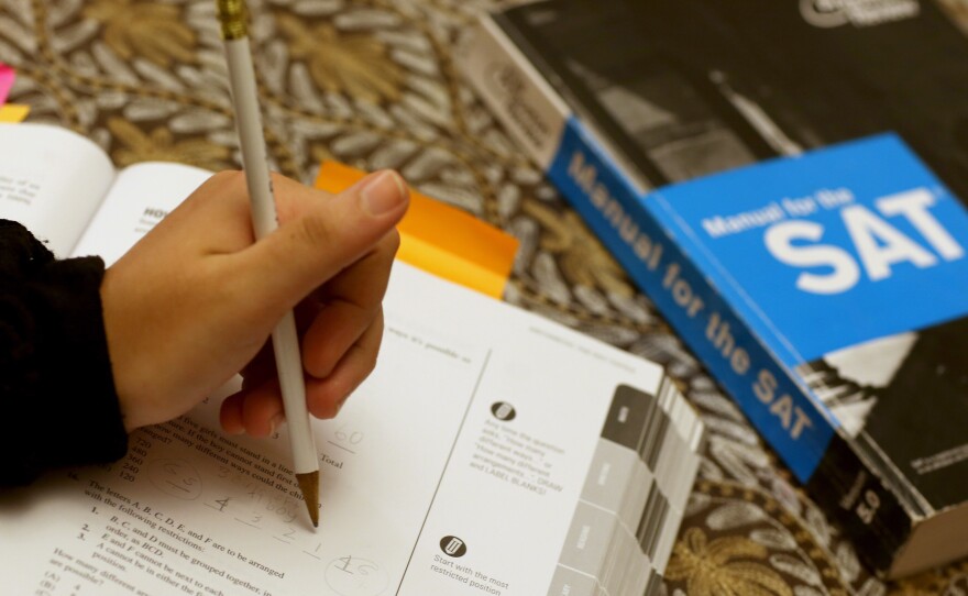 Suzane Nazir uses a Princeton Review SAT Preparation book to study for the test on March 6, 2014 in Pembroke Pines, Florida. Yesterday, the College Board announced the second redesign of the SAT this century, it is scheduled to take effect in early 2016.