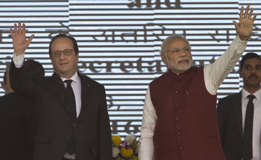French President Francois Hollande (left) and Indian Prime Minister Narendra Modi arrive for a ceremony Monday to lay the foundation stone for the headquarters of the International Solar Allliance at Gurgaon, on the outskirts of New Delhi, India.