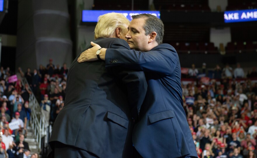 President Trump embraces Sen. Ted Cruz during a campaign rally at the Toyota Center in Houston, Texas, Monday.