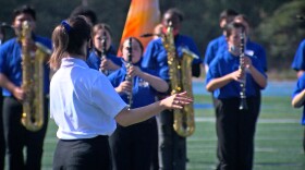 Rose Parade drum major Aaliyah Frace leads the Sapphire Sound, Mira Mesa High School's marching band, in a performance at the school's football field, Nov. 5, 2021.