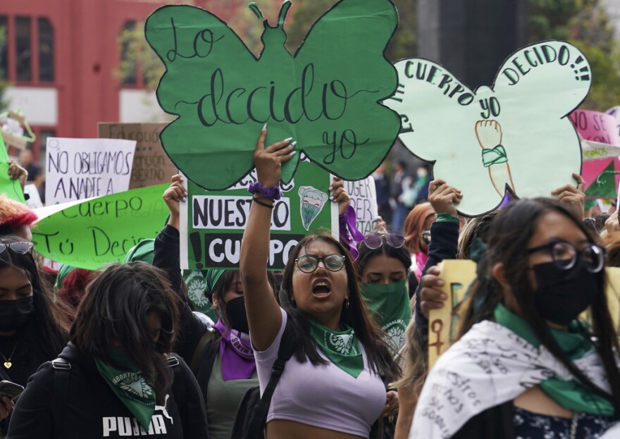 A woman holds up a sign with a message that reads in Spanish; "I will decide" as she joins a march demanding legal, free and safe abortions for all women, marking International Safe Abortion Day, in Mexico City, Sept. 28, 2022. Mexico’s Supreme Court on Wednesday, Sept. 6, 2023, has decriminalized abortion nationwide.