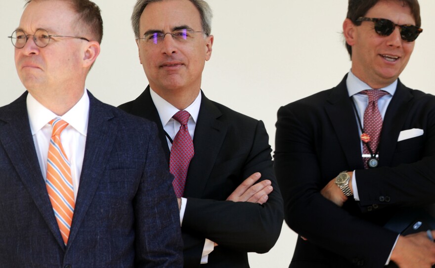 White House counsel Pat Cipollone (center) stands with acting Chief of Staff Mick Mulvaney (left) and spokesman Hogan Gidley in 2019.
