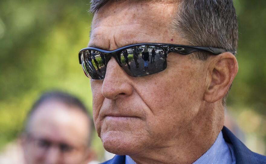 Michael Flynn, President Donald Trump's former national security adviser, leaves federal court following a status conference with U.S. District Judge Emmet Sullivan, in Washington, in September.