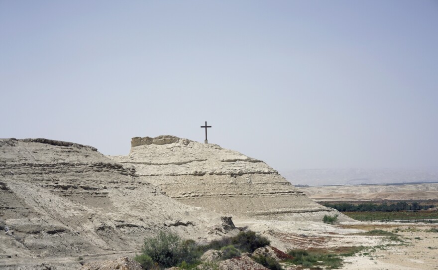 Jesus' baptism site overlooking the Jordan River, 6 miles north of the Dead Sea. The Jordanian site includes the spot where UNESCO says Jesus was believed to have been baptized, now inland after the river changed course, as well as Elijah's Hill, where tradition says the Prophet Elijah ascended to heaven in a flaming chariot.