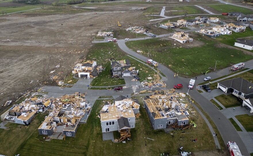 Damaged houses are seen after a tornado passed through the area near Omaha, Neb., on Friday.