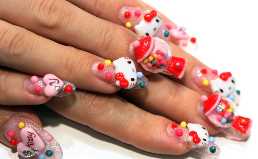 A nail artist shows off her Hello Kitty nails during the Tokyo Nail Expo in 2009.