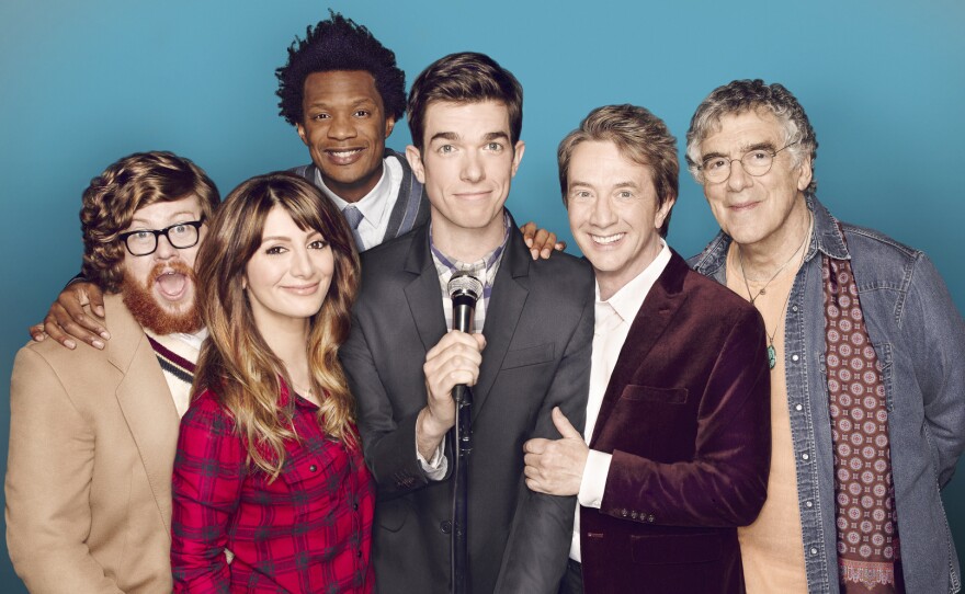 Comedian John Mulaney, center, stars with, from left, Zack Pearlman, Nasim Pedrad, Seaton Smith, Martin Short and Elliott Gould on the Fox sitcom Mulaney.