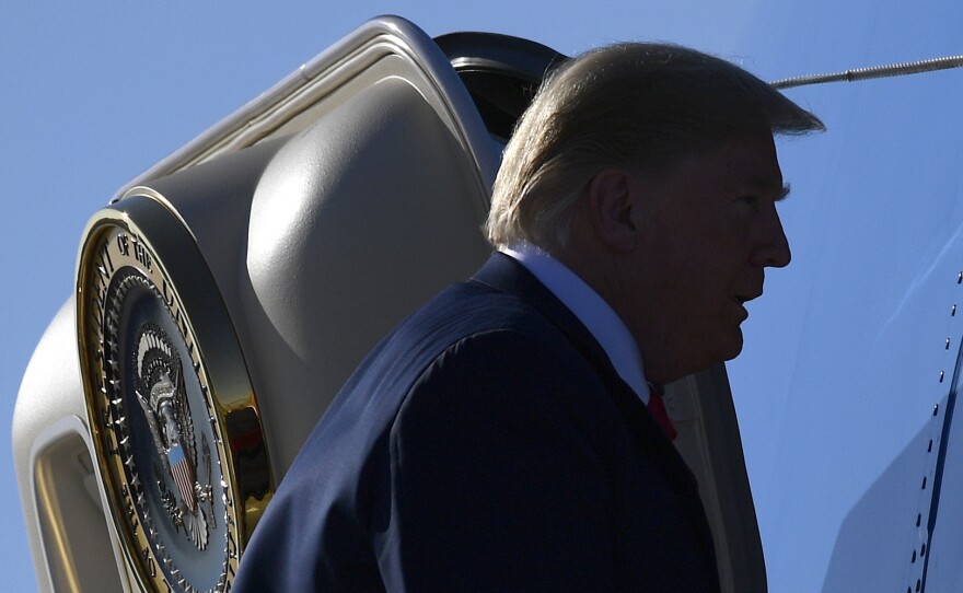President Donald Trump walks up the steps of Air Force One at Sioux Falls Regional Airport, S.D., on Sept. 7.