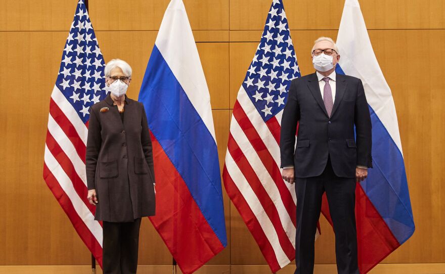 U.S. Deputy Secretary of State Wendy Sherman (left) and Russian deputy Foreign Minister Sergei Ryabkov (right) pose for pictures as they attend security talks on soaring tensions over Ukraine, at the U.S. permanent Mission, in Geneva on Jan. 10.