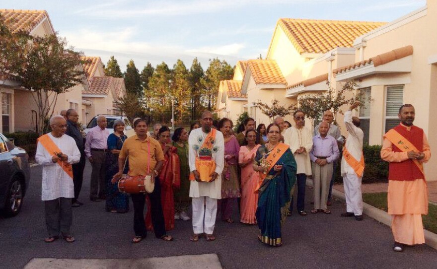 Residents of ShantiNiketan, a retirement community near Orlando, Fla., walk in a Hindu religious procession.